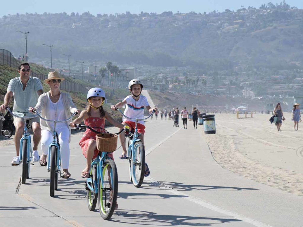 family biking on redondo beach