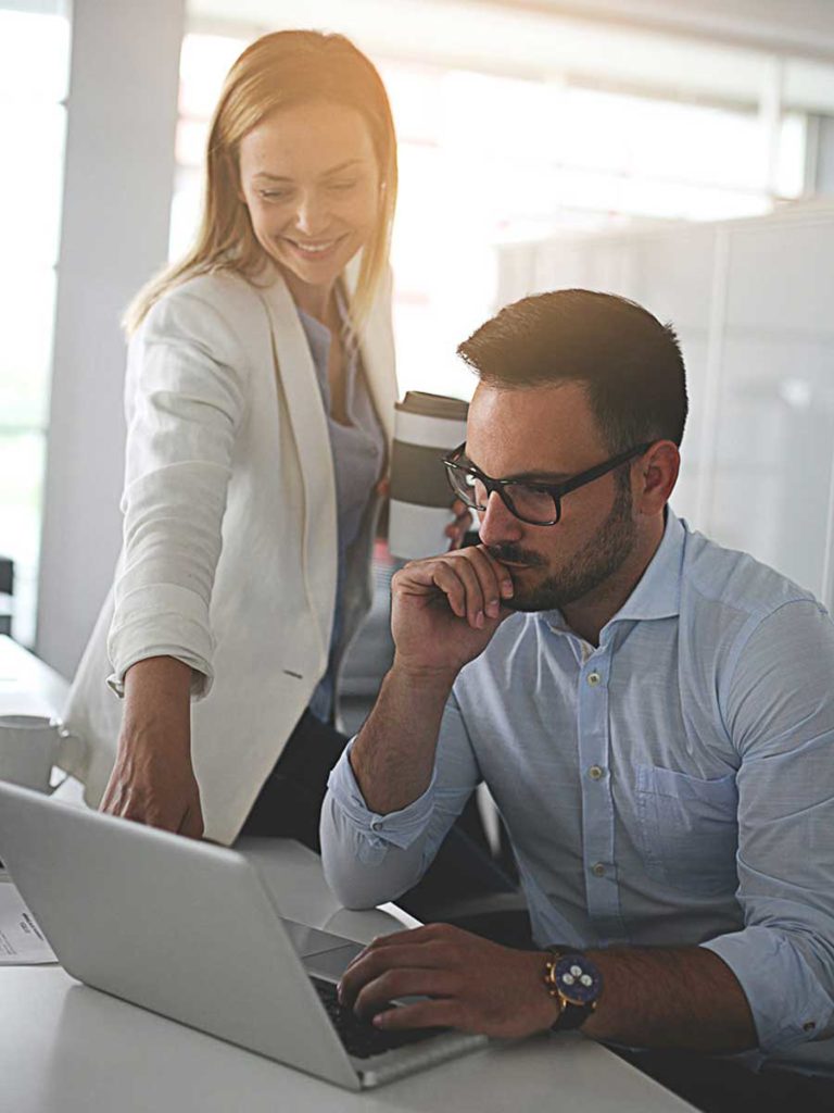 Two People Working On A Business Project.