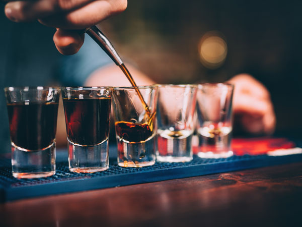 bartender poring 5 shots