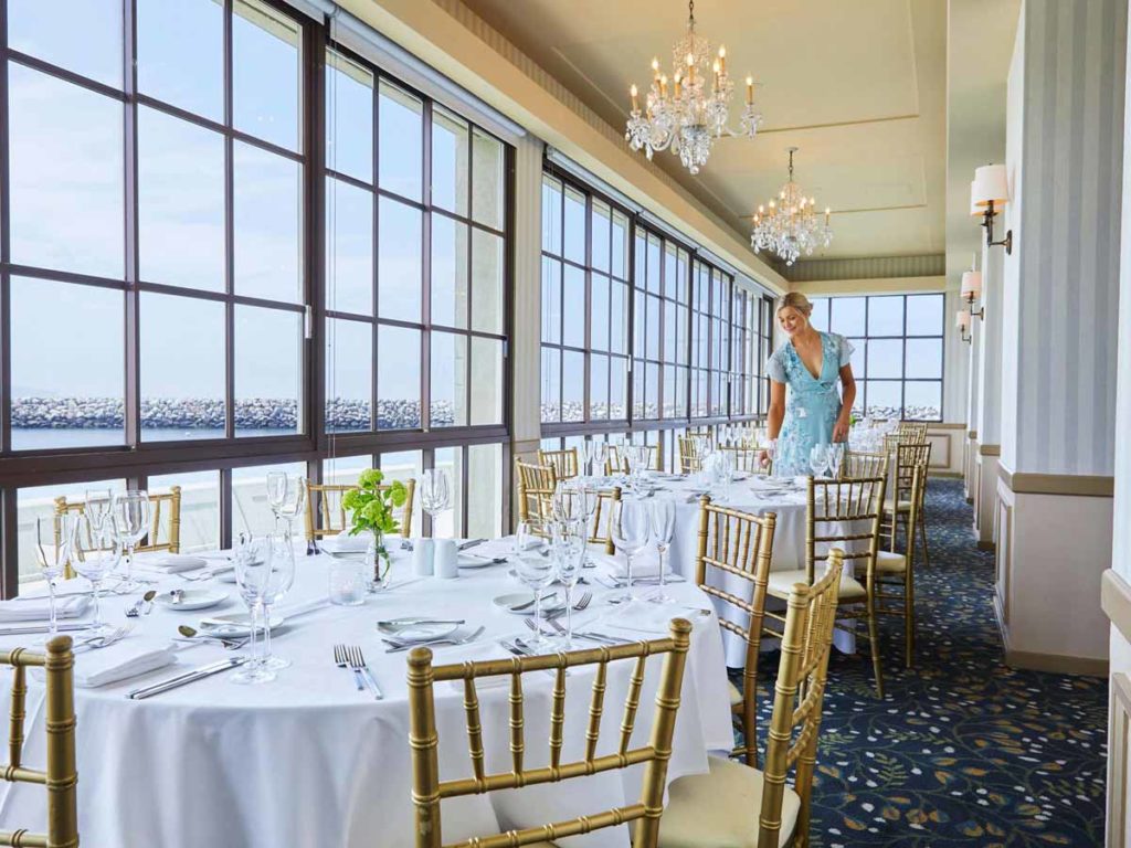 Lady Setting Up For A Wedding Reception.