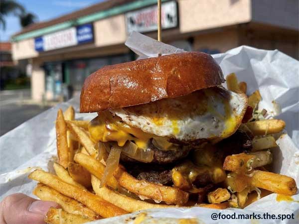 burger with fries and egg