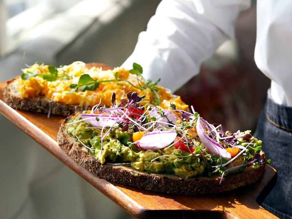 Platter Of Food On A Wooden Cutting Board.
