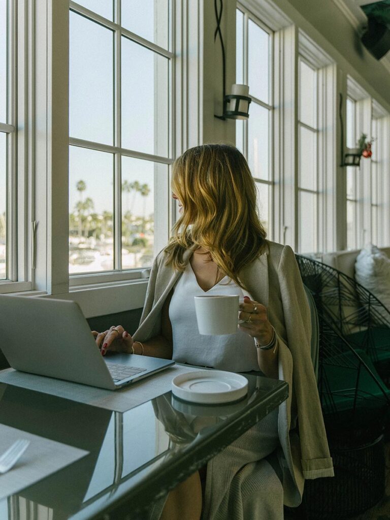 Lady Working On A Computer At BALEEN Kitchen