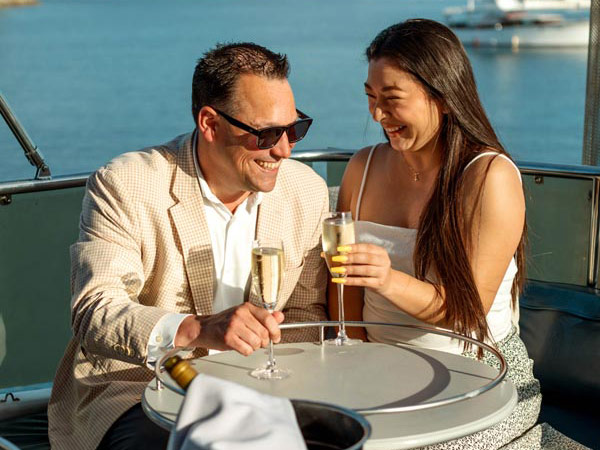Couple Having Champagne On A Boat
