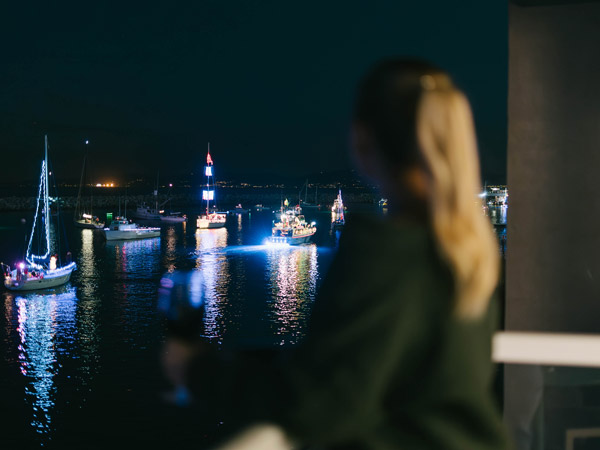 Lady Watching Christmas Boats