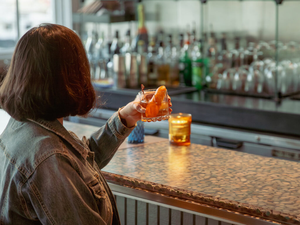Lady With A Cocktail At The Bar