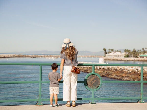 Mom And Son Looking At The Ocean