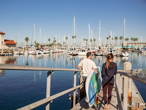 Couple Paddleboarding In California
