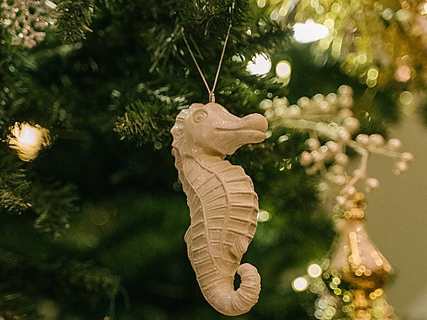 Glittered seahorse ornament on a Christmas tree at A Coastal Christmas Bar inside The Portofino Hotel & Marina, Redondo Beach, California